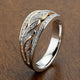 Hollow, shiny, braided gold and silver ring