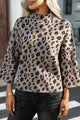 Gemütlicher Strickpullover mit Leopardenmuster und lockerem Rollkragen