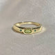 Golden Ring with Inlays of Olive Glass