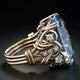 Gold ring with blue zircon in vintage look