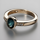 Gold ring with blue inlaid crystal