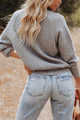 Gemütlicher lässiger Strickpullover mit Reißverschluss und Patchwork-Kragen